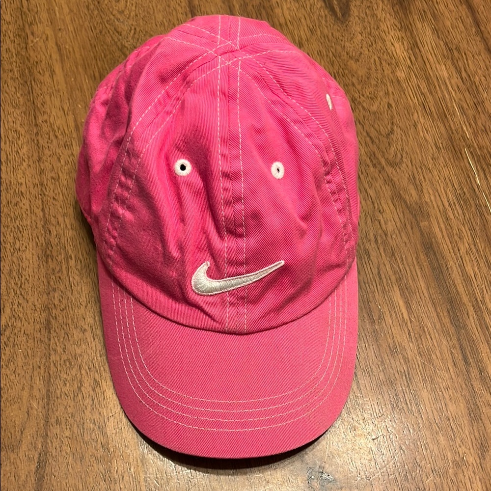 Nike Pink Hat with Swoosh Logo and Adjustable Fit for children.